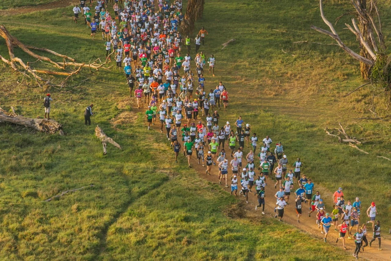a group of people running on a trail